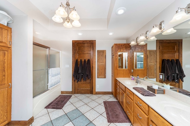 bathroom featuring a raised ceiling, a chandelier, shower / bath combination with glass door, vanity, and tile patterned flooring