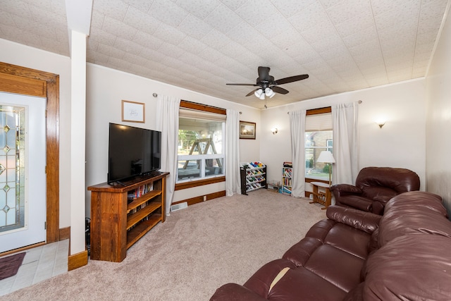 carpeted living room featuring a healthy amount of sunlight and ceiling fan