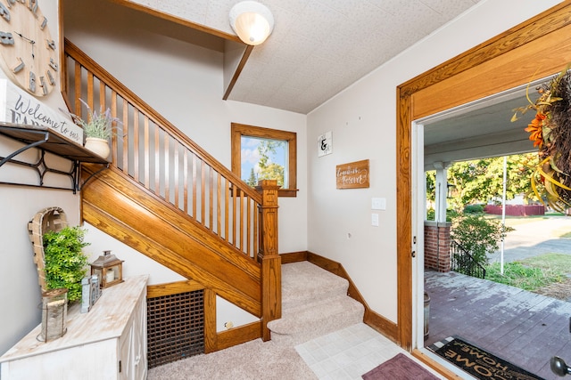 entrance foyer with carpet