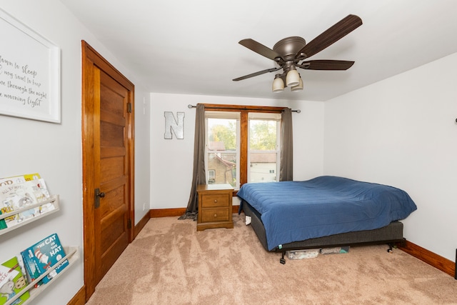 bedroom with light colored carpet and ceiling fan