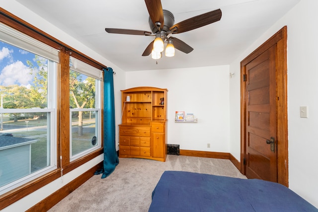 bedroom with light colored carpet and ceiling fan