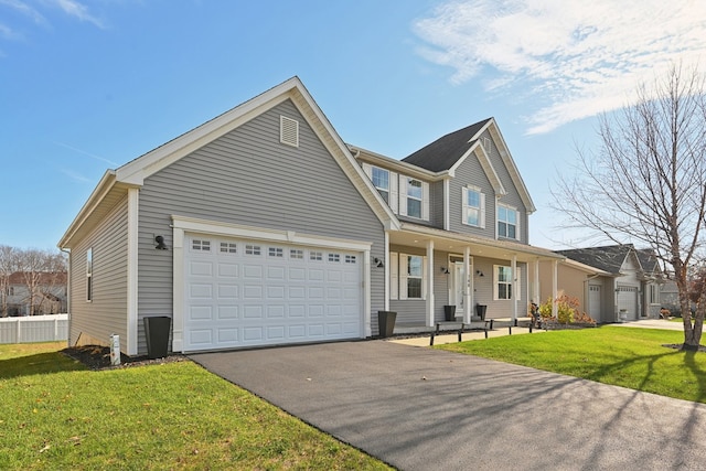 view of front of property featuring covered porch and a front yard