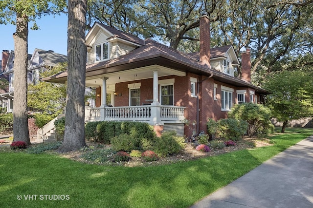 319 Gale Ave, River Forest, IL 60305 - cape cod-style house featuring brick siding, a front yard, and covered porch