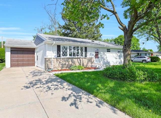 single story home featuring a front yard and a garage