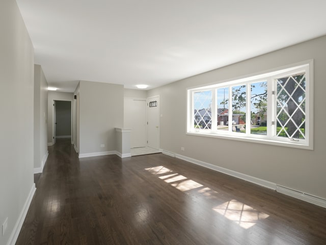 unfurnished room featuring dark wood-type flooring