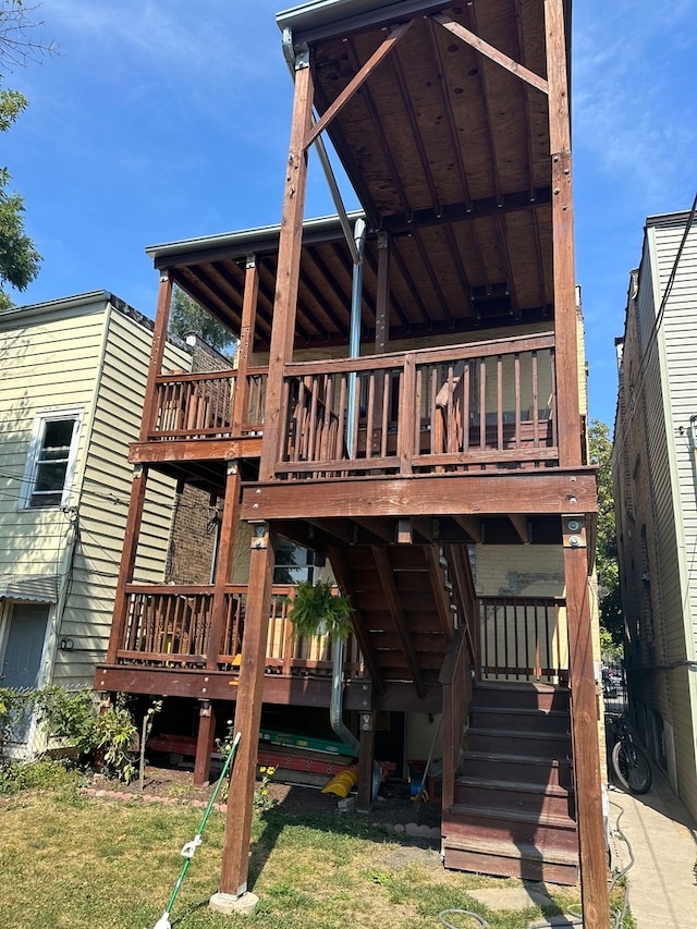 back of house featuring a deck