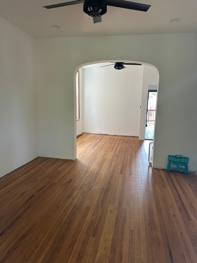 spare room featuring ceiling fan and hardwood / wood-style flooring