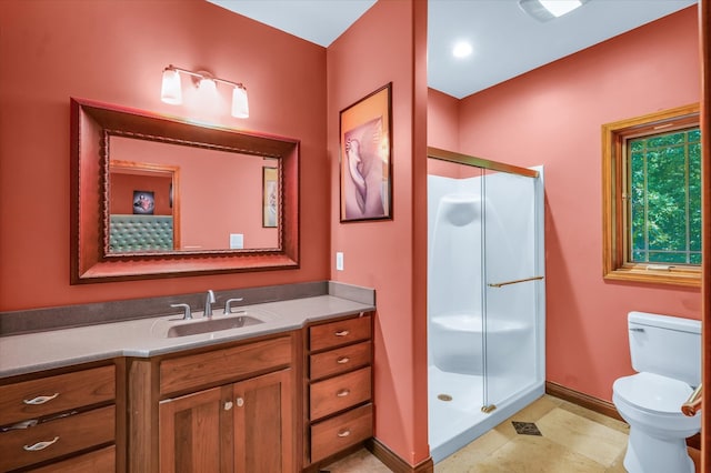 bathroom featuring walk in shower, vanity, toilet, and tile patterned floors