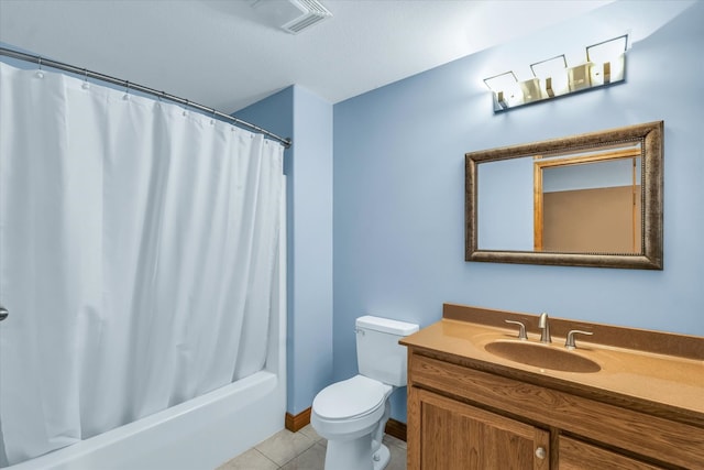 full bathroom with shower / tub combo with curtain, vanity, tile patterned flooring, and toilet