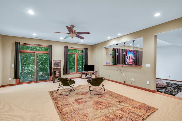 living room featuring ceiling fan and carpet floors