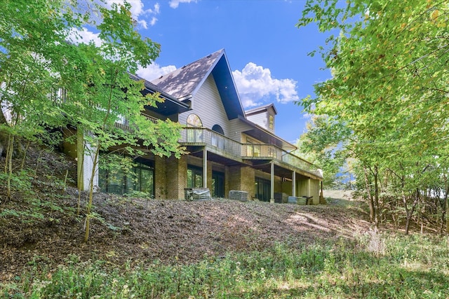 view of property exterior with a deck