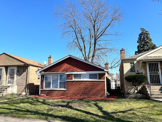 view of side of home featuring a yard