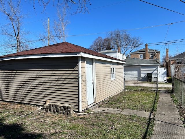 view of outbuilding with a yard and a garage