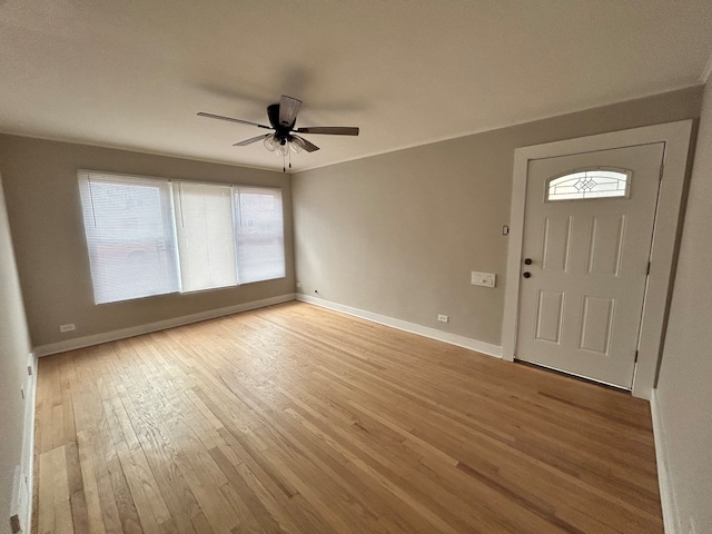 entrance foyer featuring light hardwood / wood-style floors, ceiling fan, and plenty of natural light