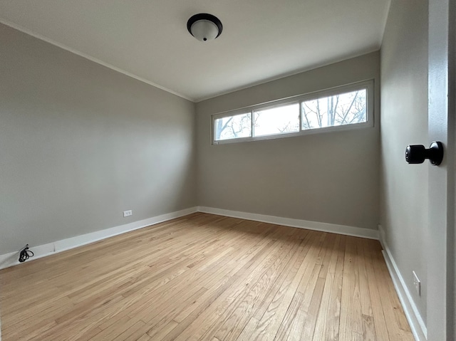 unfurnished room featuring light wood-type flooring and plenty of natural light