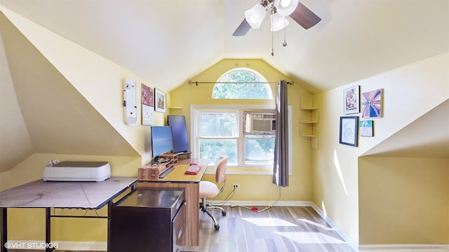 office space with light hardwood / wood-style flooring, vaulted ceiling, and ceiling fan