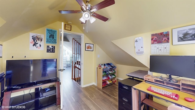 office space featuring ceiling fan, vaulted ceiling, and hardwood / wood-style floors