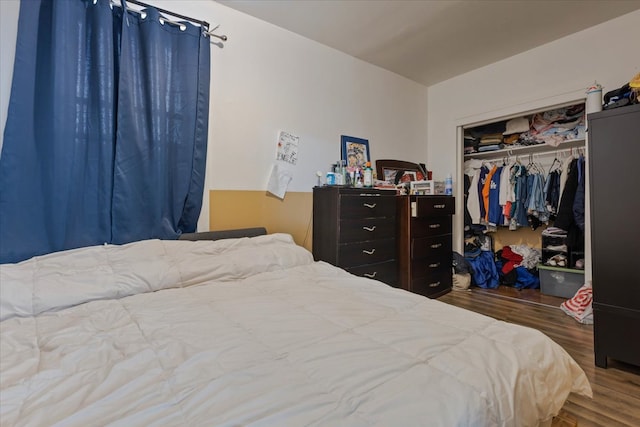 bedroom featuring hardwood / wood-style flooring and a closet