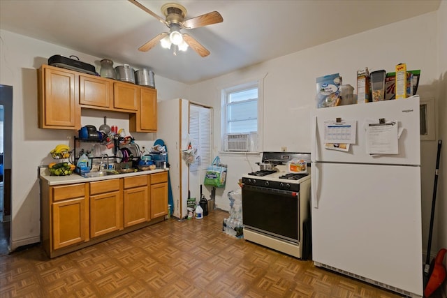 kitchen featuring ceiling fan, cooling unit, sink, white appliances, and parquet flooring