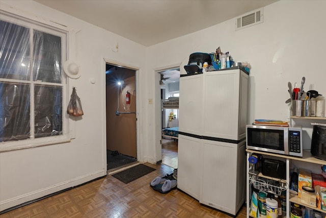 kitchen featuring parquet floors