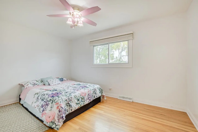 bedroom featuring wood-type flooring and ceiling fan