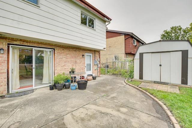 view of patio featuring a storage shed