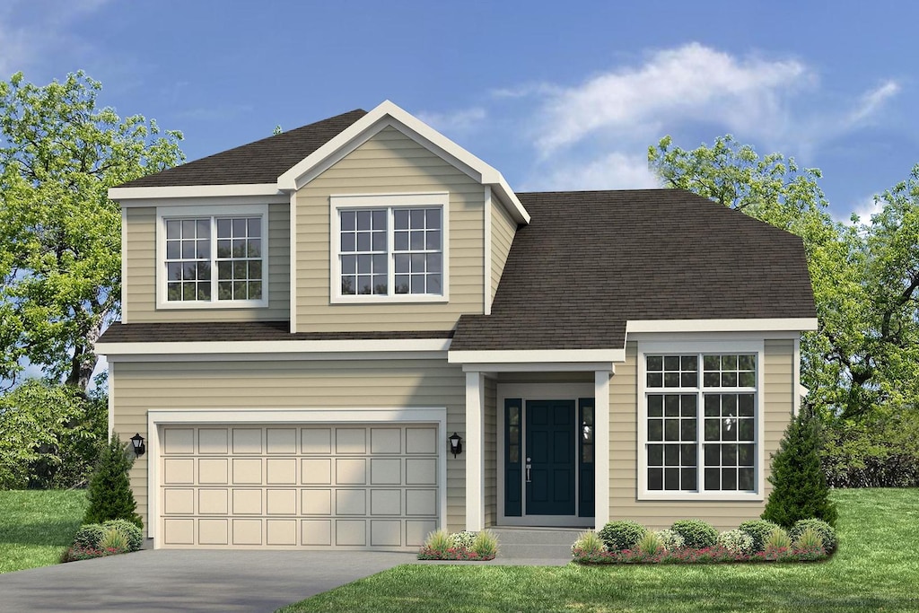 view of front of house with a front yard and a garage