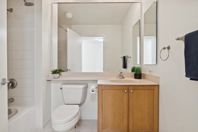 full bathroom featuring toilet, vanity, tiled shower / bath combo, and tile patterned floors