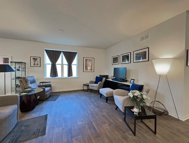 living room with dark hardwood / wood-style flooring