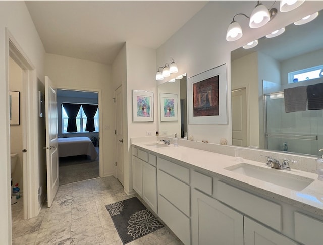 bathroom featuring vanity and a shower with door