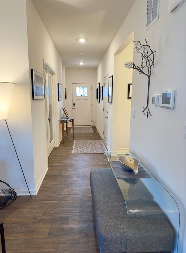 corridor with dark wood-type flooring