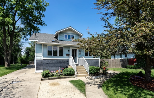 bungalow-style house with a front yard