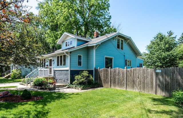 view of property exterior featuring a lawn