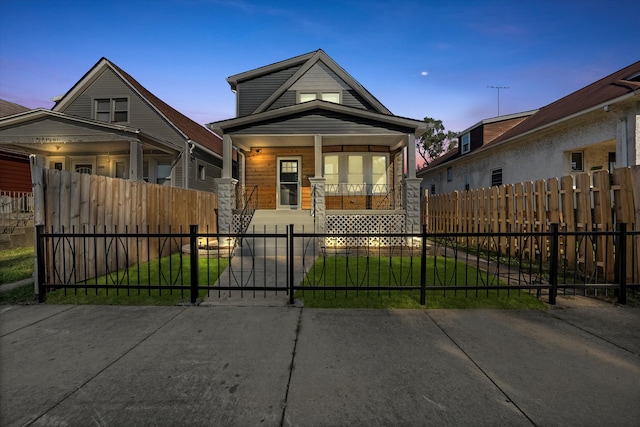 bungalow-style house with a lawn and a porch