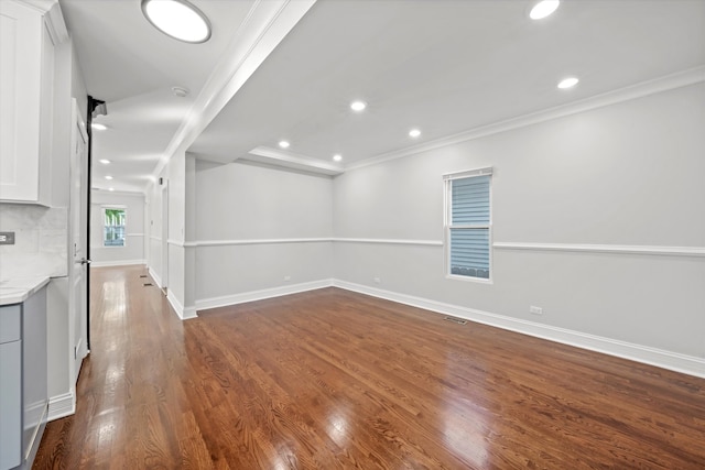 interior space with hardwood / wood-style flooring and crown molding