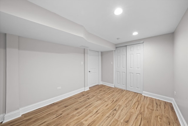 basement featuring light hardwood / wood-style floors