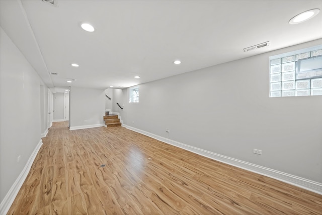 basement featuring light hardwood / wood-style flooring and plenty of natural light