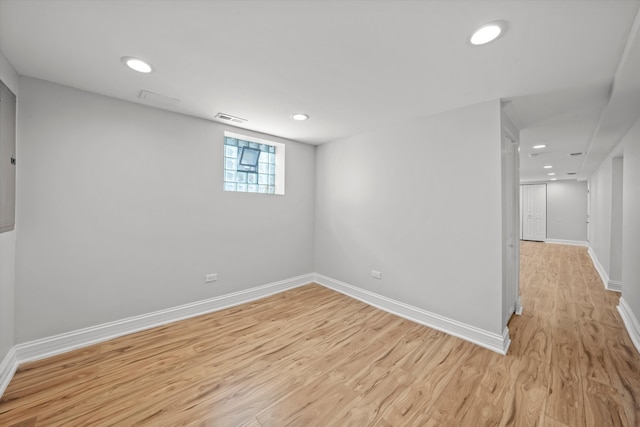 basement featuring light hardwood / wood-style flooring