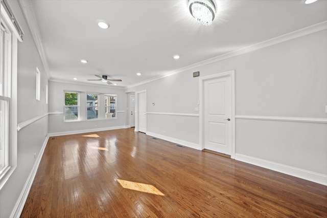 unfurnished living room featuring crown molding, hardwood / wood-style floors, and ceiling fan