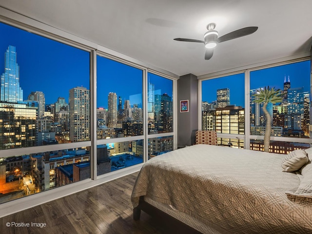 757 N Orleans St Unit 1612, Chicago, IL 60654 - bedroom featuring a wall of windows, a view of city lights, and wood finished floors