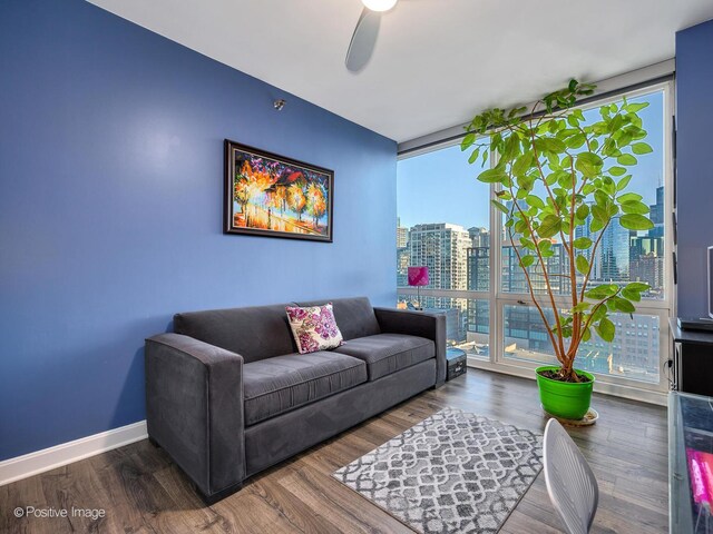 757 N Orleans St Unit 1612, Chicago, IL 60654 - living room featuring a ceiling fan, wood finished floors, expansive windows, and baseboards