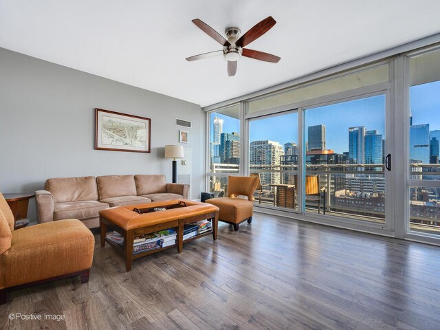 757 N Orleans St Unit 1612, Chicago, IL 60654 - living area with floor to ceiling windows, a view of skyline, a ceiling fan, and wood finished floors
