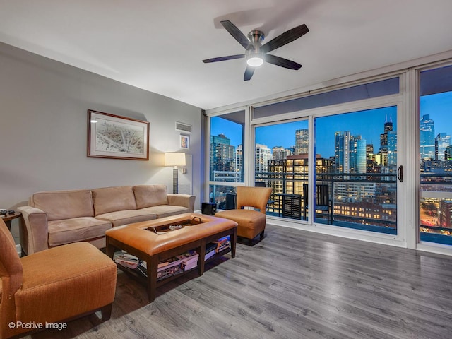 757 N Orleans St Unit 1612, Chicago, IL 60654 - living area with a skyline view, ceiling fan, wood finished floors, and expansive windows
