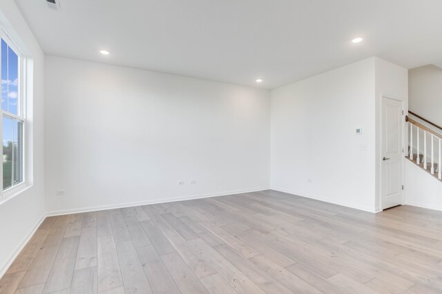 spare room featuring light hardwood / wood-style floors