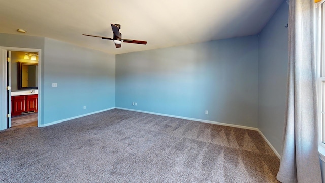 spare room featuring carpet floors and ceiling fan