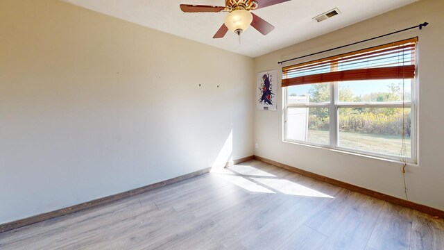 unfurnished room with ceiling fan and light hardwood / wood-style flooring