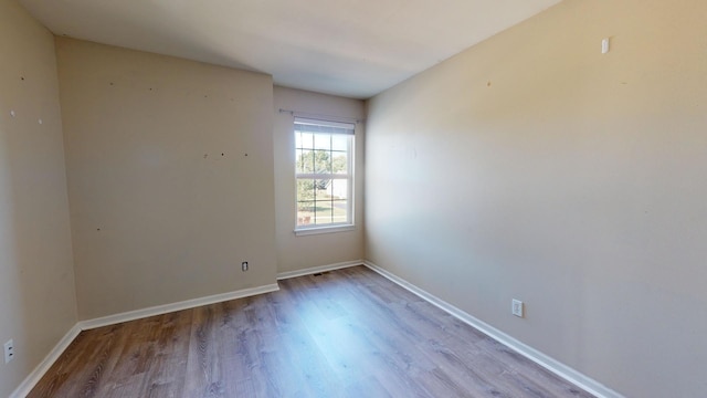 unfurnished room featuring light hardwood / wood-style flooring