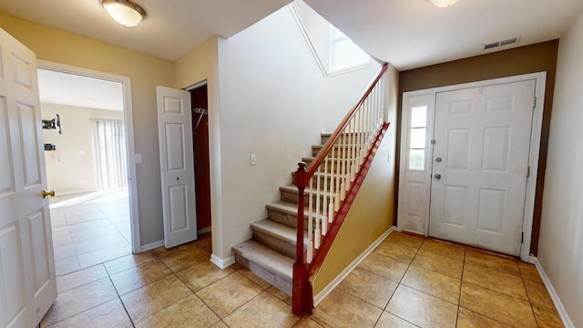 entrance foyer featuring light tile patterned flooring