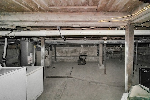 basement with gas water heater and washer / dryer