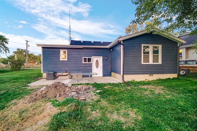 rear view of property with a patio area and a yard